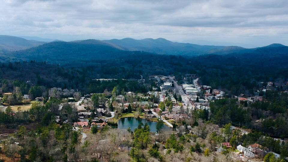Aerial view of Highlands, with the downtown area and surrounding forest