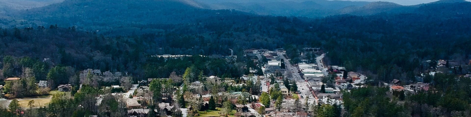 Aerial view of Highlands, with the downtown area and surrounding forest