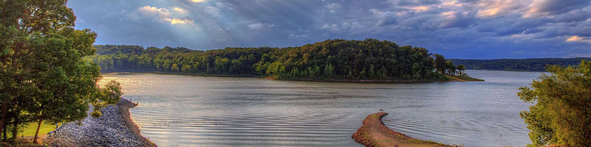 Majestic Clouds over Lake Wappapello Redman Creek Recreational Area The sun peaks out of some storm clouds over Lake Wappapello, creating some