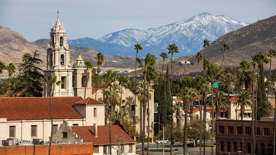 Snow capped mountain view of the historic skyline of Riverside, California, USA.