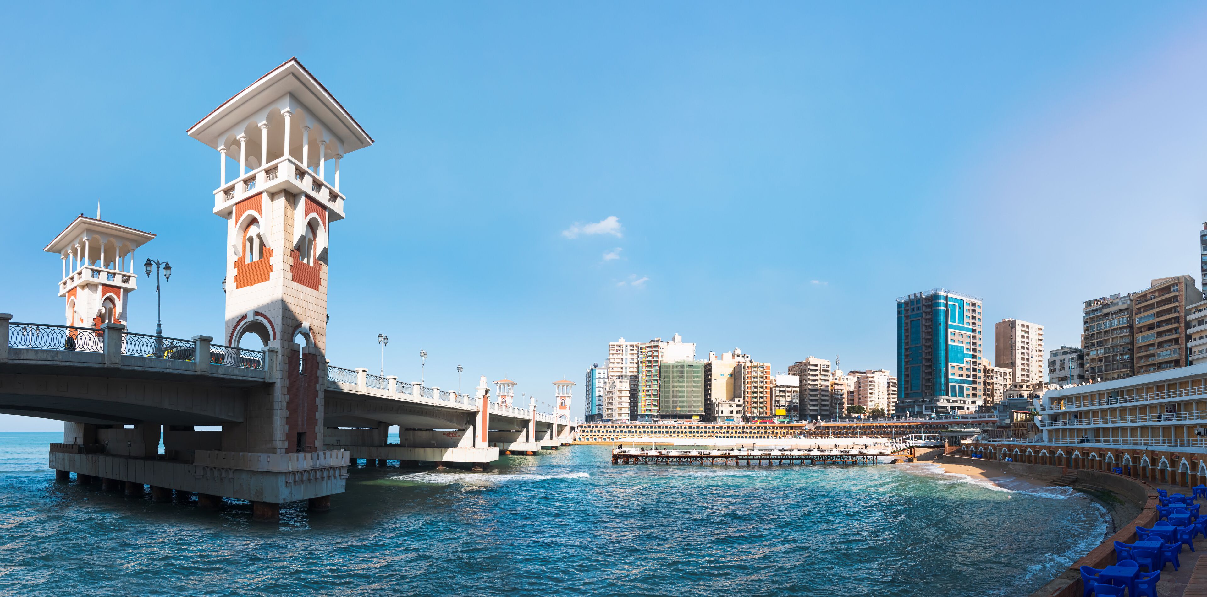 People walk the Stanley Bridge, popular landmark of Alexandria, Egypt