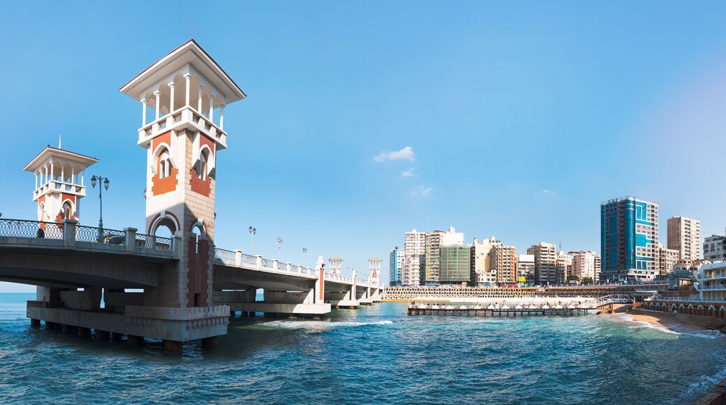 People walk the Stanley Bridge, popular landmark of Alexandria, Egypt