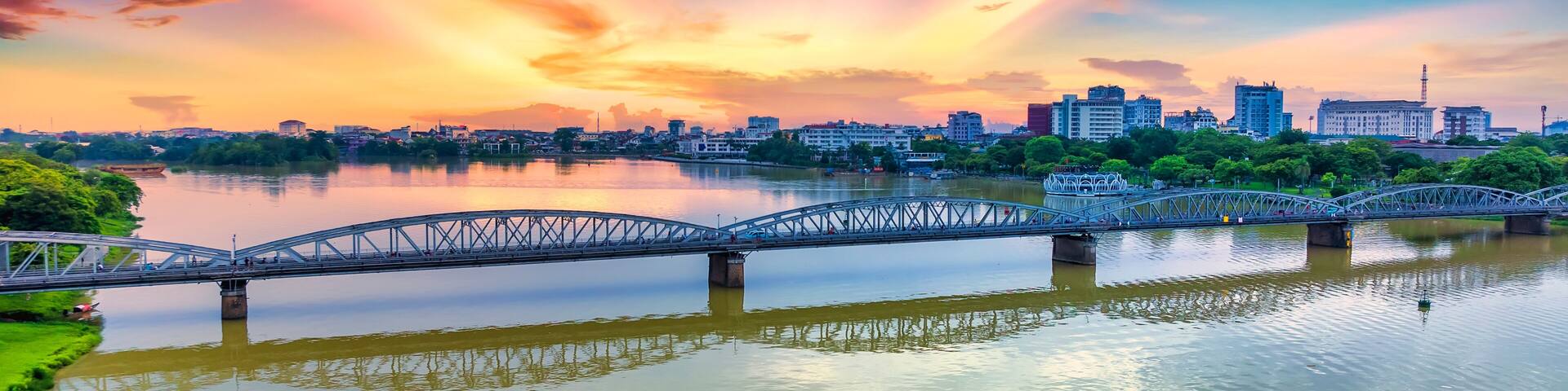Aerial view of dawn sunrise at Trang Tien Bridge in Hue, Vietnam. This is a Gothic architectural bridge spanning the Perfume river from the 18th century designed by Gustave Eiffel