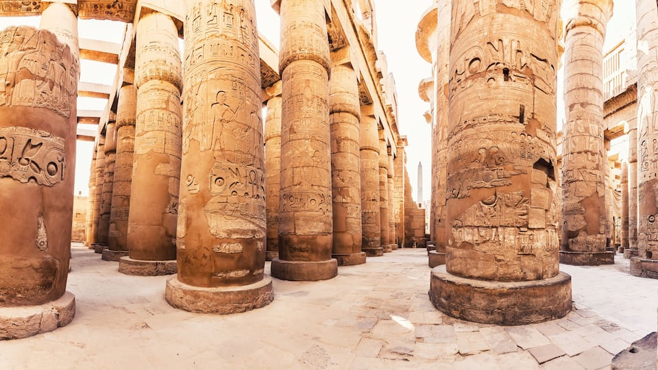 Karnak Temple columns with ancient carvings, Luxor, Egypt