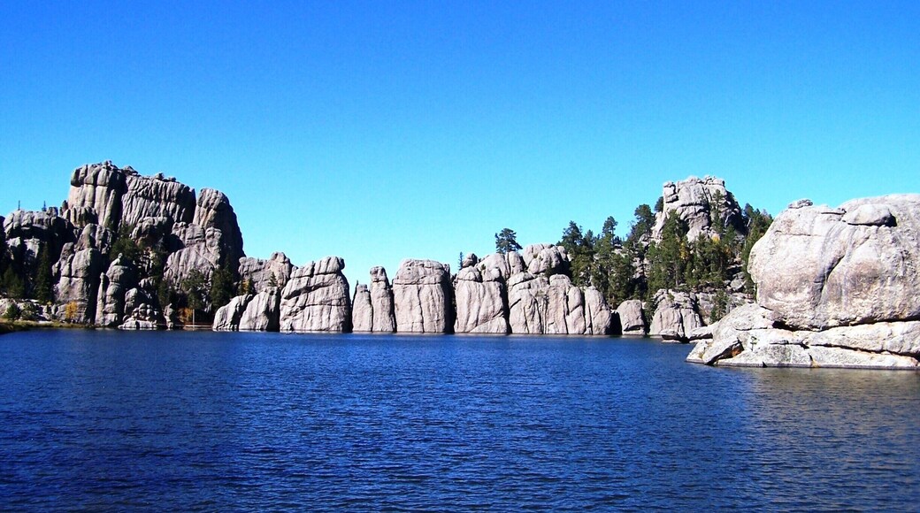 Sylvan Lake, known as the "crown jewel" of Custer State Park, is located in the Black Hills of South Dakota. Created in 1881 when Theodore Reder built a dam across Sunday Gulch, it offers picnic areas, rock climbing, small rental boats, swimming, and hiking trails. It is also popular as a starting point for excursions to Harney Peak and The Needles. A hotel was operated on the shore of the lake in the early 20th century.
The lake was featured in Disney's 2007 film National Treasure: Book of Secrets. The film made the lake appear to be located directly behind Mount Rushmore when in reality it is actually five miles southwest of Mount Rushmore.