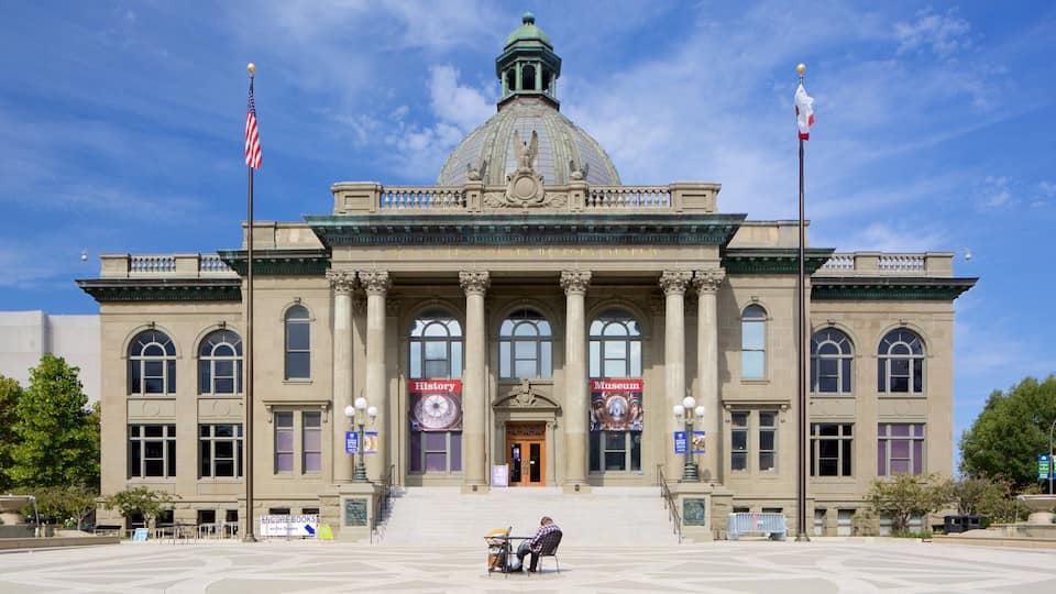 Redwood City showing an administrative buidling and heritage architecture as well as an individual male