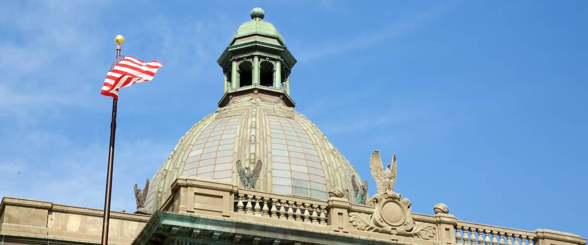 The San Mateo County History Museum with a large dome, an American flag, and ornate architectural details.