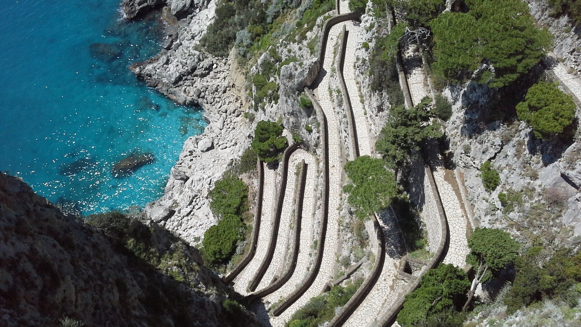 Via Krupp is a historic switchback paved footpath on the island of Capri, connecting the Charterhouse of San Giacomo and the Gardens of Augustus area with Marina Piccola. Commissioned by German industrialist Friedrich Alfred Krupp, the path covers an elevation difference of about 100 m.

Built between 1900 and 1902, ostensibly Via Krupp was a connection for Krupp between his luxury hotel, Grand Hotel Quisisana, and Marina Piccola, where his marine biology research vessel lay at anchor.Since 1976, Via Krupp has been closed most of the time due to the danger of falling rocks.
#blue