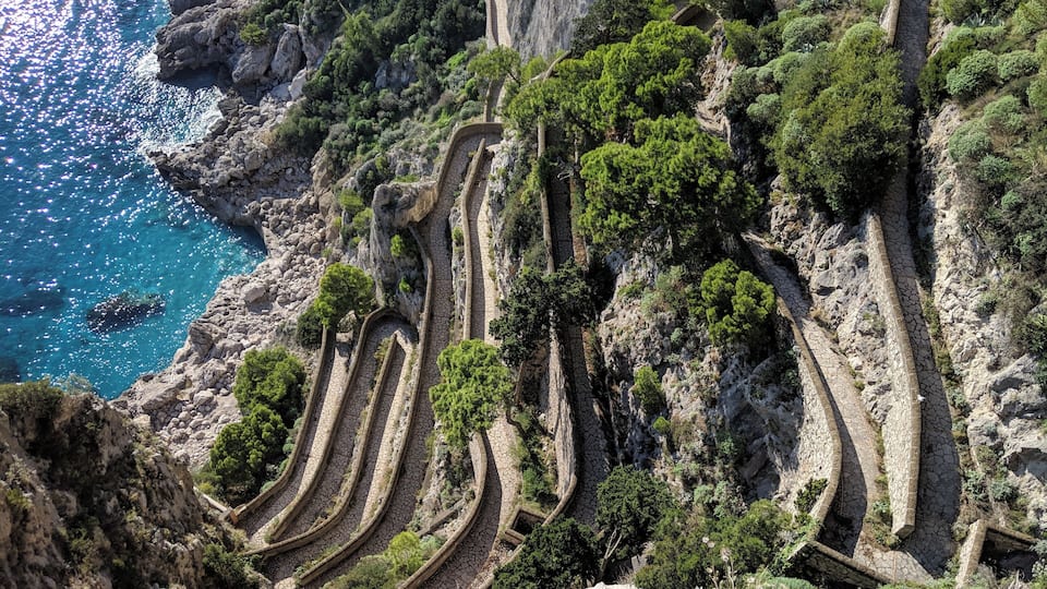 Capri had so many gorgeous viewpoints but I loved this shot of the walkway down to the vibrant blue water #italy #capri #europe #travel #water #mediterranean