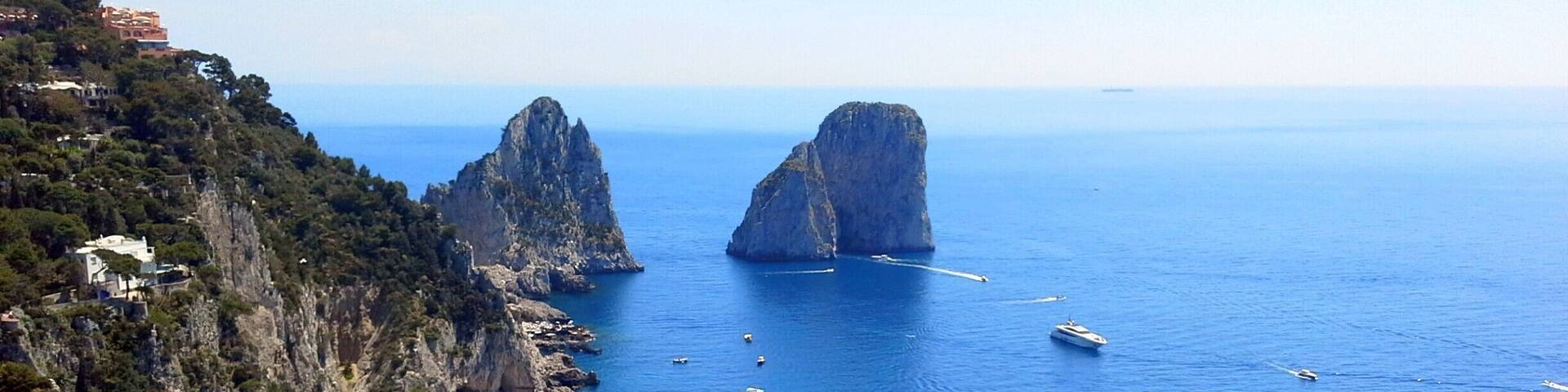 Faraglione - Stella, di Mezzo and di Fuori: Capri's legendary trio of sea giants. One of the first images to come to mind will, no doubt, be that of the Faraglioni: the three spurs of rock which rise up out of the sea, within meters of the island's Southern coast. The rocks have each been given a name: the first, still attached to the land, is called Stella, the second, separated from the first block by a stretch of sea; Faraglione di Mezzo and the third, Faraglione di Fuori or Scopolo, meaning the head or promontory stretching into the sea. The Scopolo sea stack provides the unique habitat for the Podarcis sicula coerulea. The rock is, in fact, the only place in the world where you can find this lizard, the blue color of which is said to be the result of the amphibian's vicinity to the sea and sky. The average height of the Faraglioni is 100 meters. The Faraglione di Mezzo is characterized by a central cavity, large enough to allow for the passage of a small boat.
#blue #BestOf5