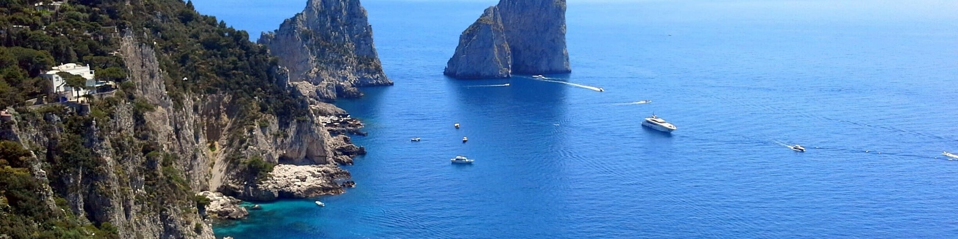 Faraglione - Stella, di Mezzo and di Fuori: Capri's legendary trio of sea giants. One of the first images to come to mind will, no doubt, be that of the Faraglioni: the three spurs of rock which rise up out of the sea, within meters of the island's Southern coast. The rocks have each been given a name: the first, still attached to the land, is called Stella, the second, separated from the first block by a stretch of sea; Faraglione di Mezzo and the third, Faraglione di Fuori or Scopolo, meaning the head or promontory stretching into the sea. The Scopolo sea stack provides the unique habitat for the Podarcis sicula coerulea. The rock is, in fact, the only place in the world where you can find this lizard, the blue color of which is said to be the result of the amphibian's vicinity to the sea and sky. The average height of the Faraglioni is 100 meters. The Faraglione di Mezzo is characterized by a central cavity, large enough to allow for the passage of a small boat.
#blue #BestOf5