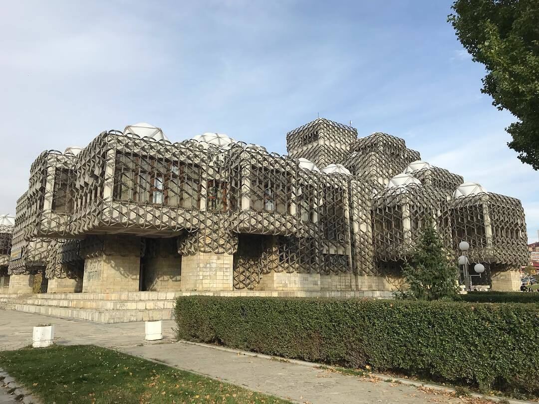 A modern architectural building with a unique geometric design.