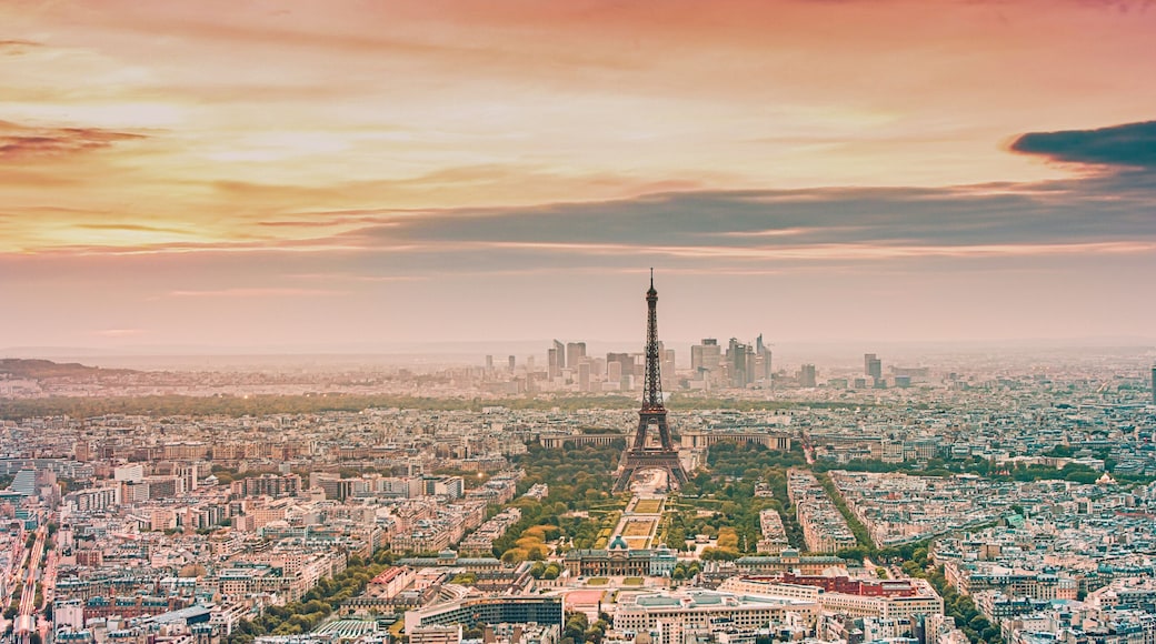 aerial view over Paris at sunset with iconic Eiffel tower