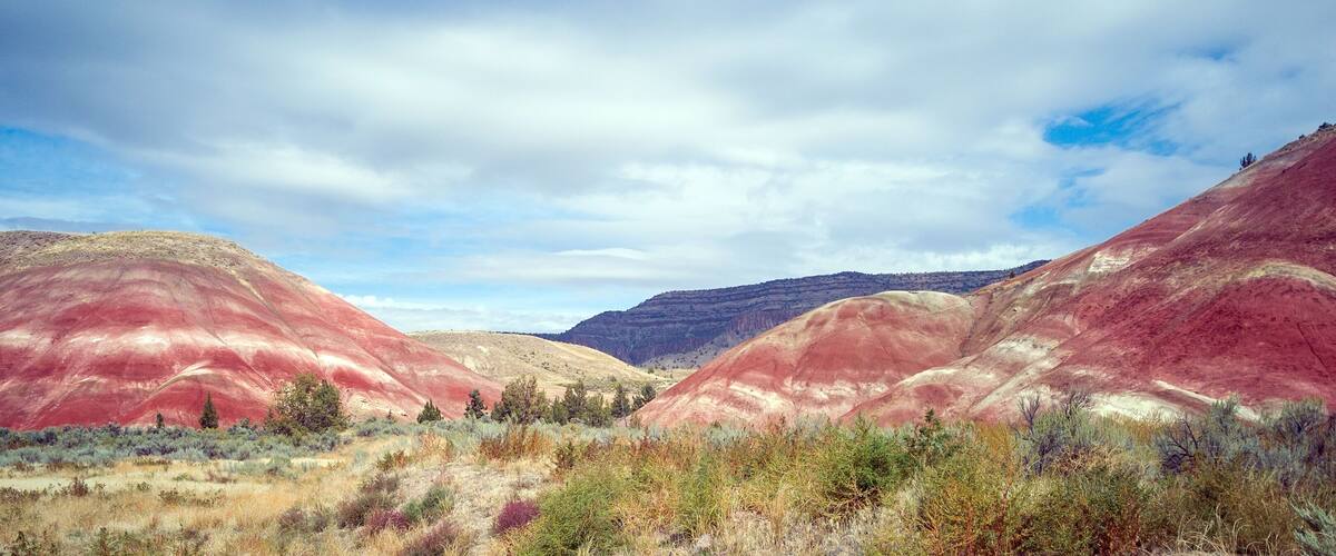 Pulchritudinous images in the polychromatic Painted Hills Unit of the John Day Fossil Beds. Listed as one of the seven wonders of Oregon. Located outside the Quaint town of Mitchell in Wheeler County