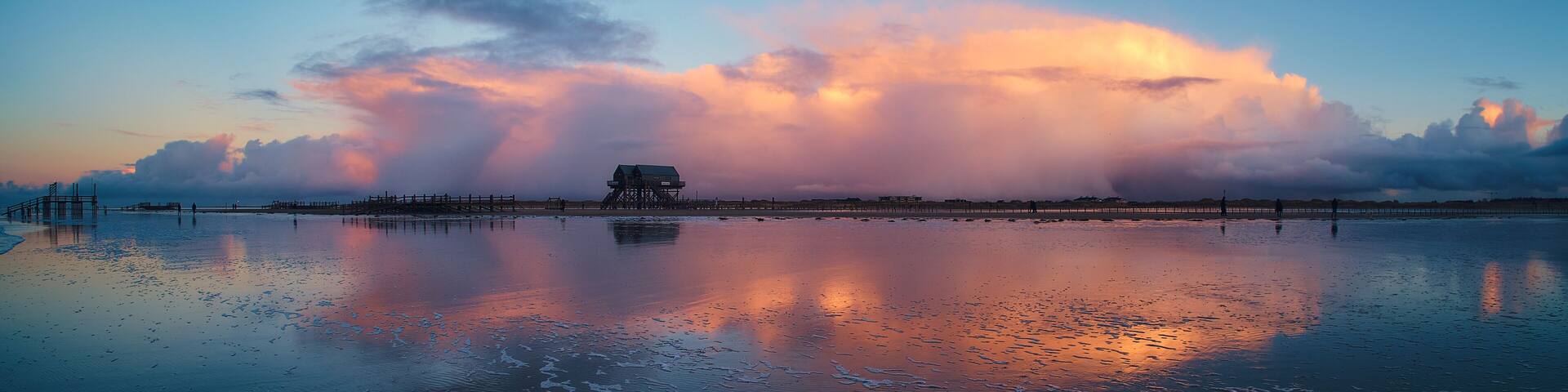 Clouds over Beach in Sankt Peter-Ording. High quality photo