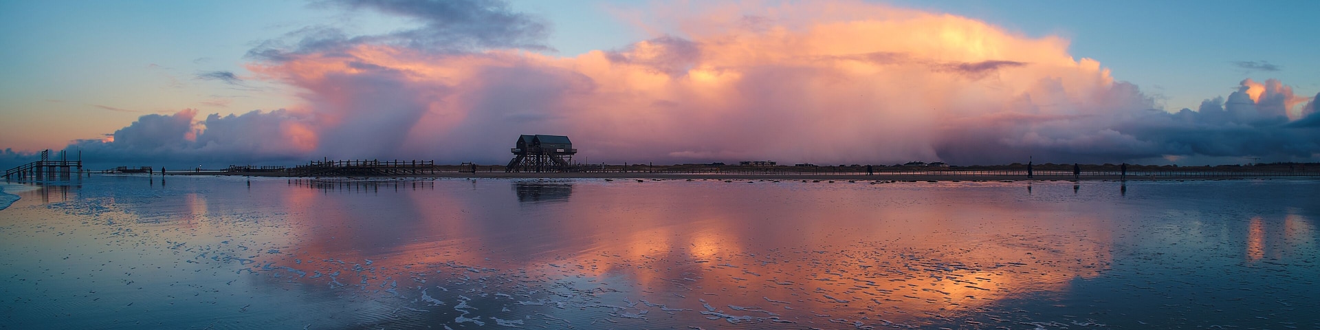 Clouds over Beach in Sankt Peter-Ording. High quality photo