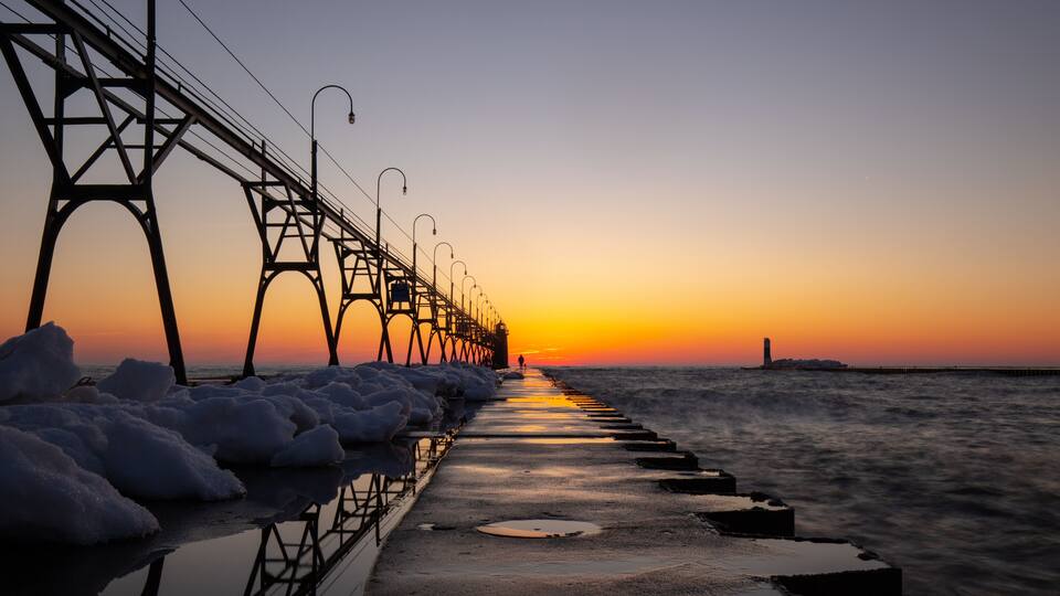 Lighthouse and lake side trail at beautiful sunset at South Haven Lake Michigan