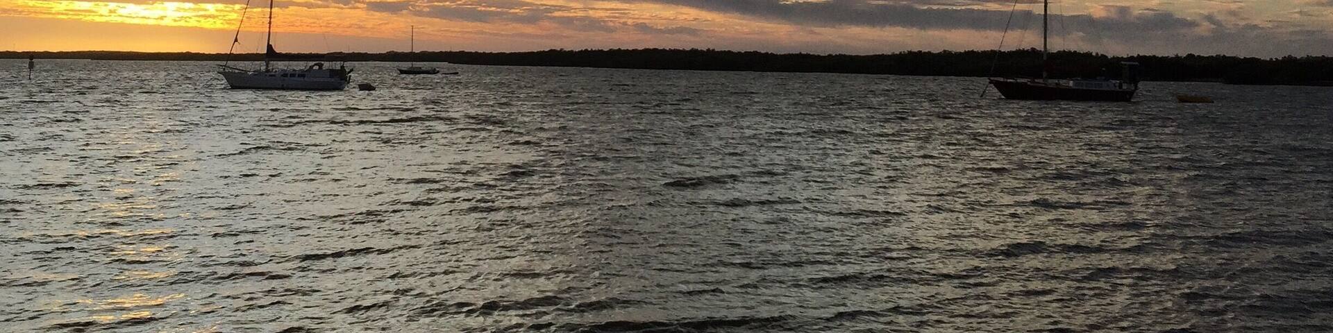 Carnarvon, north west Western Australia. Sun setting over inlet with dramatic cloud formation