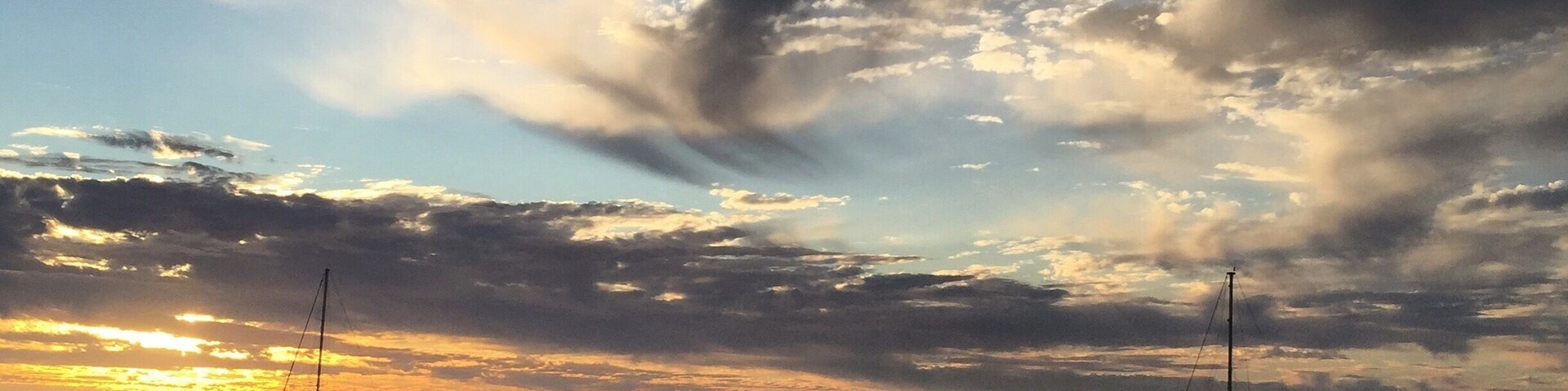 Carnarvon, north west Western Australia. Sun setting over inlet with dramatic cloud formation