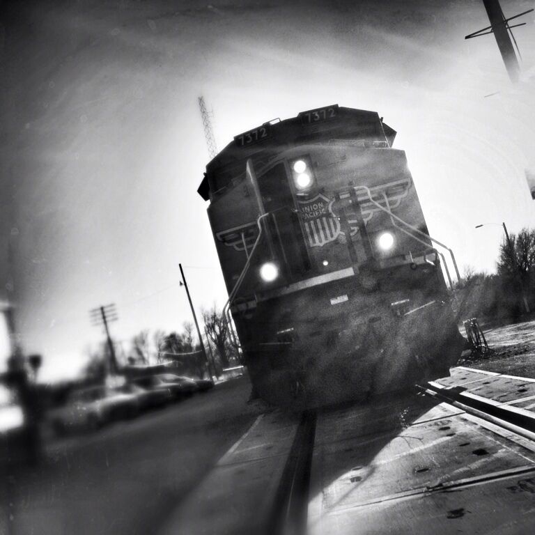 It's highly illegal to even be on the tracks, let alone only feet in front of a locomotive. But forget the illegal part if this thing is moving, because this would be the last thing you'd see. A ton of people die every year from being hit by trains. They're much faster than you think. If it's a Z-Train, they'll most likely be traveling of upwards of 90mph. So unless you're like me and you work for the railroad... You should probably stay off the tracks. :)