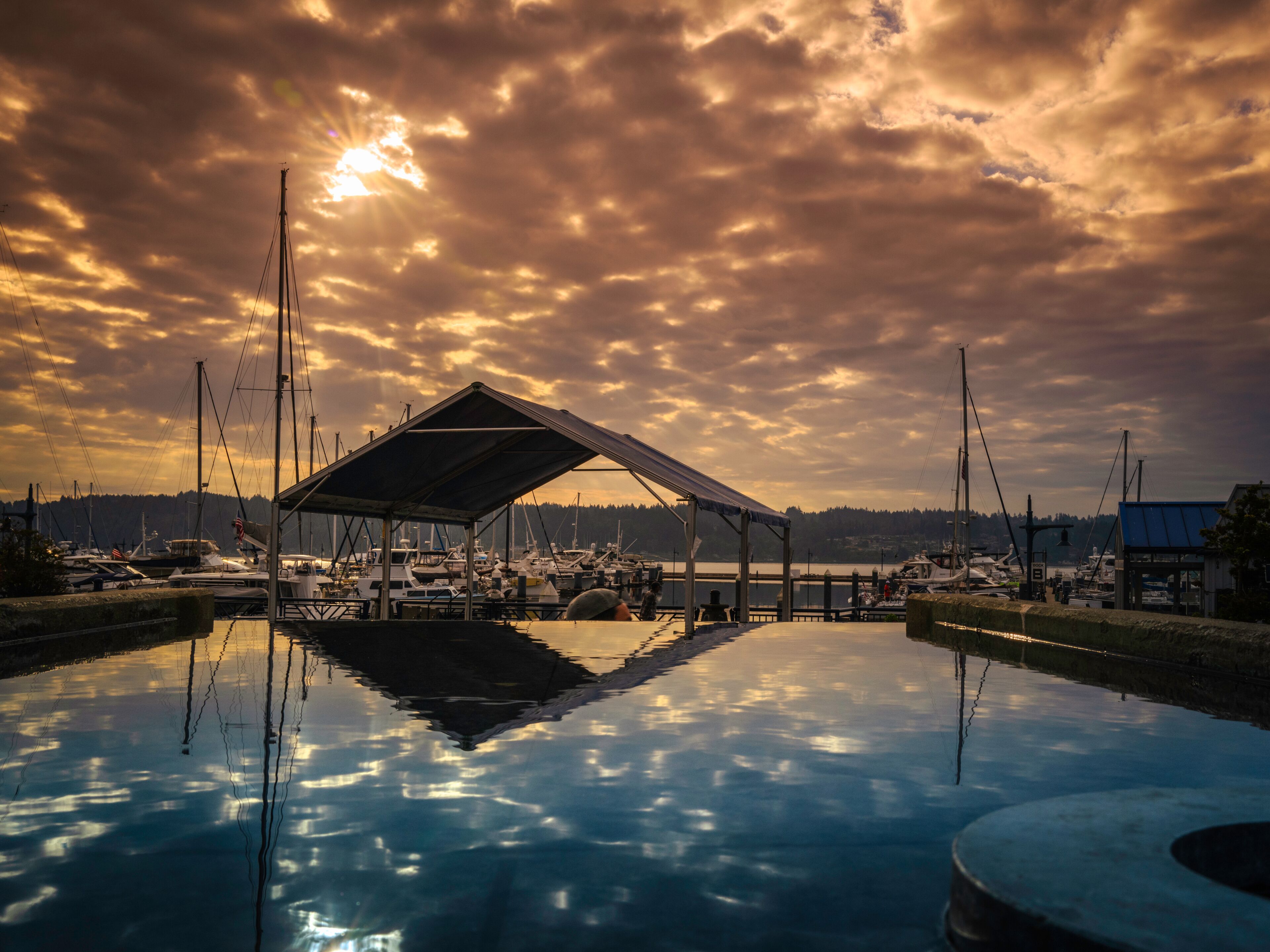Dramatic cloudscape and water reflections over Sinclair Inlet near Bremerton Ferry Terminal in Washington State