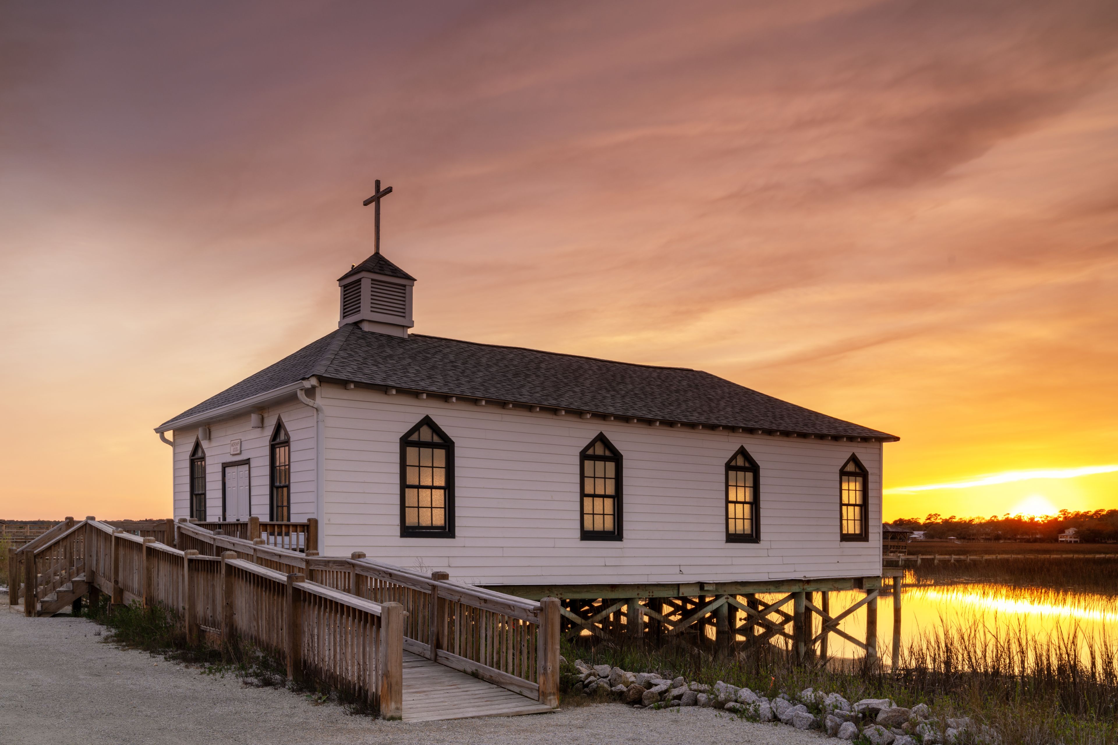 the historic Pawleys Island chapel on the salt marsh at sunset