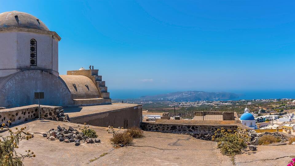 A panorama view across the castle ruins in Pyrgos, Santorini in summertime