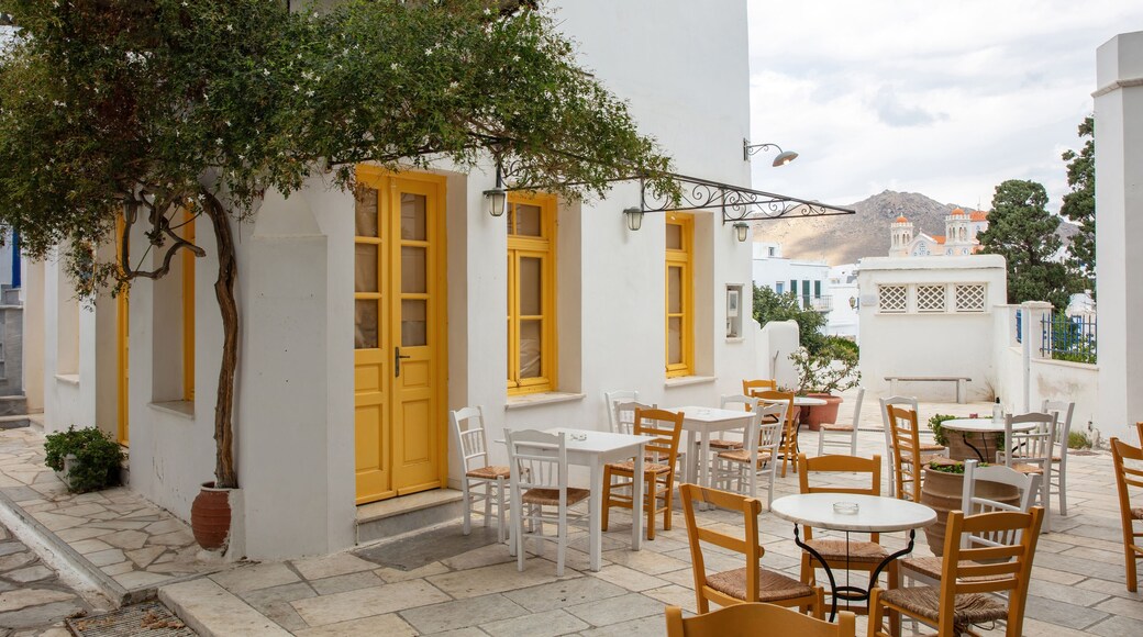 Greece. Tinos island Cyclades. Outdoors traditional cafe with yellow windows at Pyrgos village