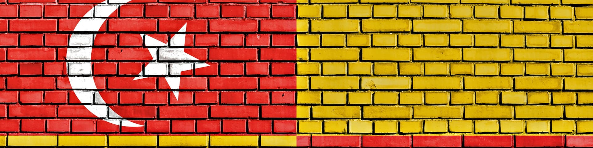 A brick wall with a flag design.