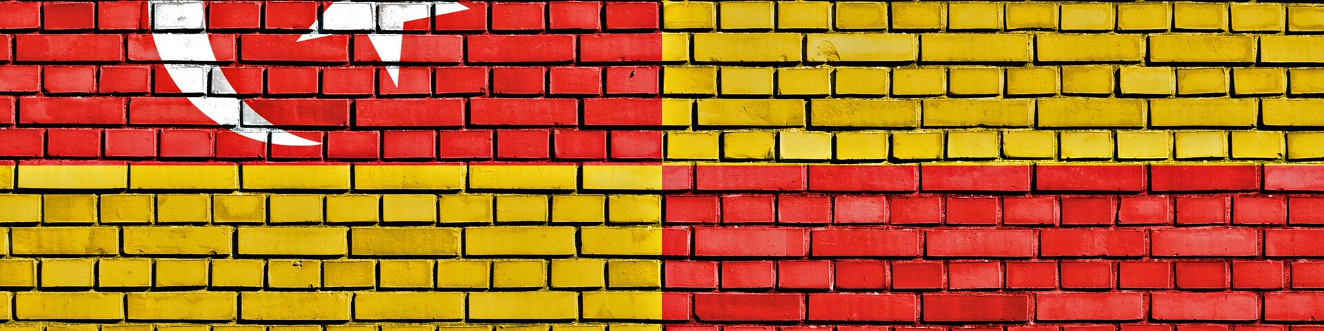 A brick wall with a flag design.