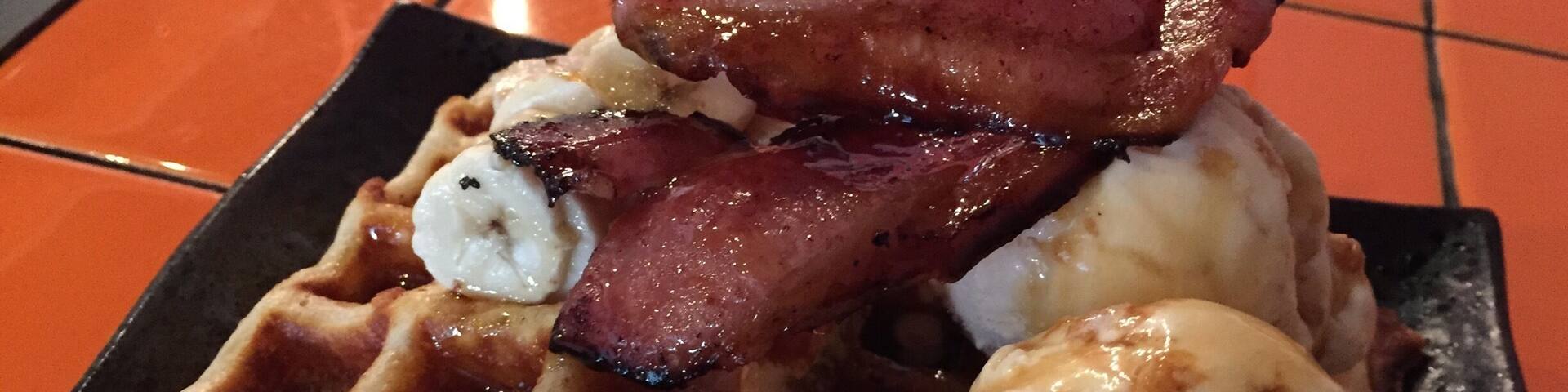 One of my favourites here. Waffles with ice cream and bacon :) Wash it down with a cup of #flatwhite