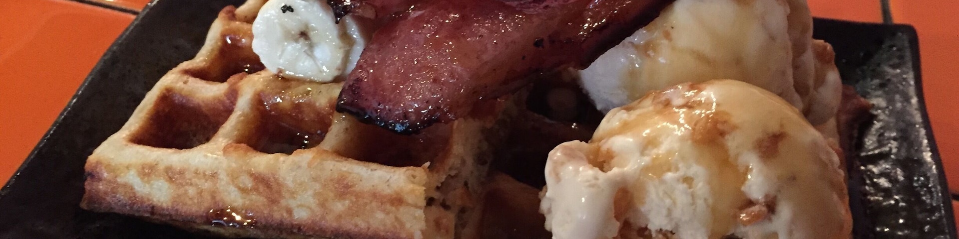 One of my favourites here. Waffles with ice cream and bacon :) Wash it down with a cup of #flatwhite
