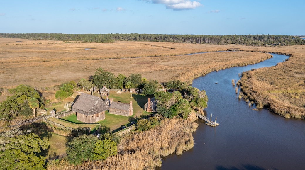 Aerial view of Fort King George historic site, oldest English fort on the Georgia coast from the 17th century with wooden palisade, gun ports for cannons blue cloudy sky near Darien Georgia USA