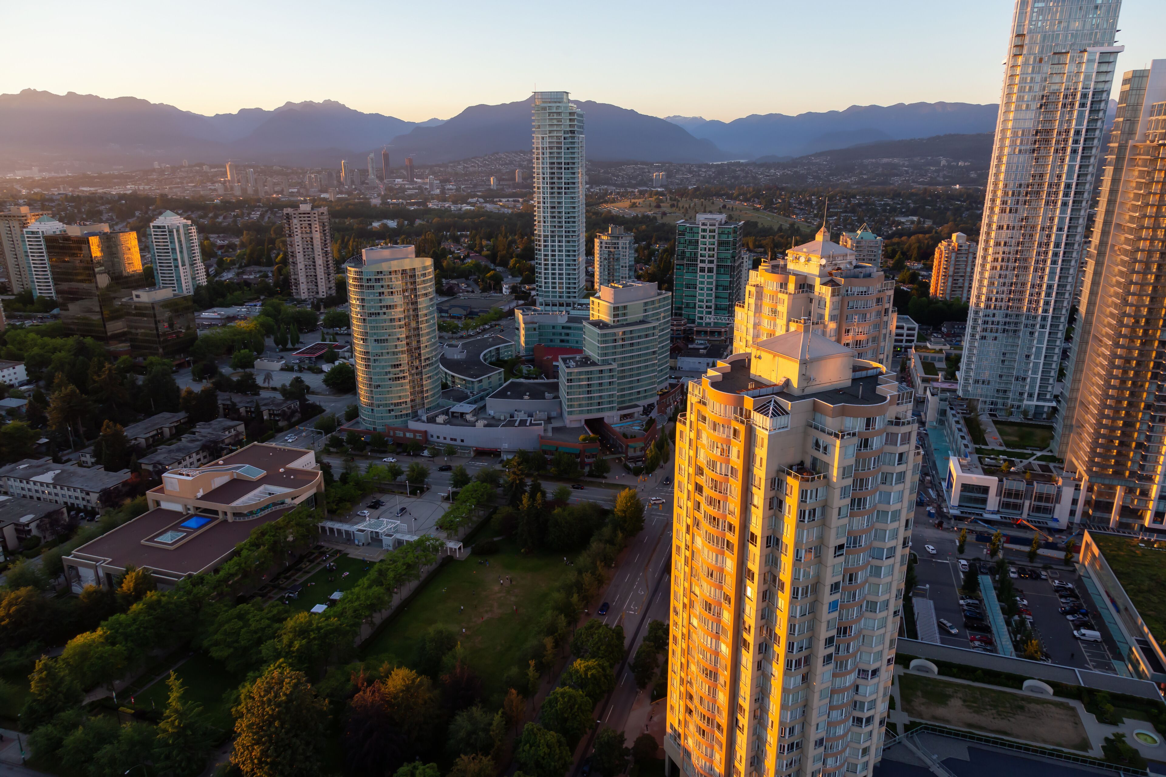 Aerial view of a modern city during a vibrant sunset. Taken in Metrotown, Burnaby, Vancouver, BC, Canada.
