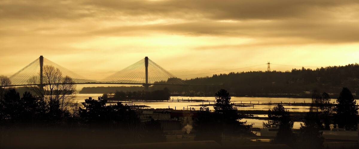 Sunrising over Port Mann Bridge - view from Sapperton skytrain station. As soon as scanning your ticket to out from the station, take a momnet to look right side and this is the view you will see in the morning.