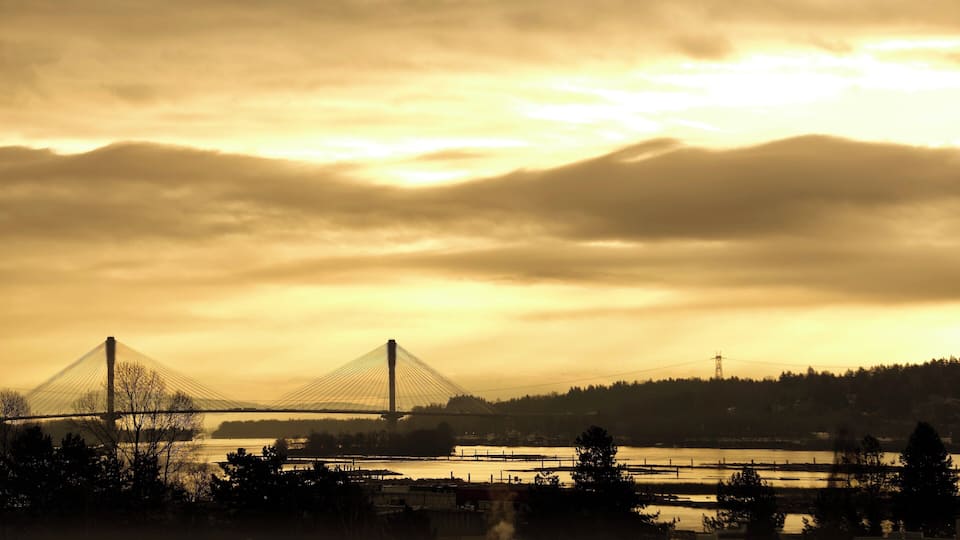 Sunrising over Port Mann Bridge - view from Sapperton skytrain station. As soon as scanning your ticket to out from the station, take a momnet to look right side and this is the view you will see in the morning.