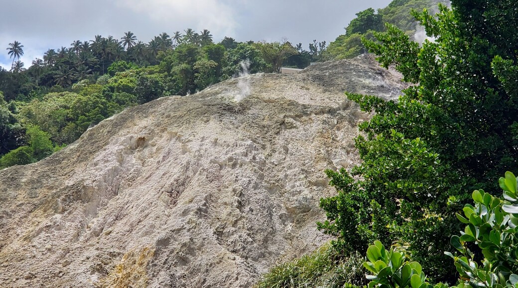 At the top of the mountain you can head to Sulphur Springs and enjoy a relaxing volcanic mud bath. I had a pretty bad sunburn and it took the sting right out and leaves you feeling super soft. First you dip into the hot water, then they paint you with the mineral rich mud, let it dry, then wash it off in the water. You will feel so good after it. While I was waiting for others to finish, I peeked around and found some nearby vents letting off their steam. It was this photo where it hit me that 'oh my goodness I'm standing next to volcanic vents' Haha. Freaked me out a bit but it was so beautiful watching them at the same time. The rocks were encrusted with minerals and occasionally you can see a whole bunch of vents just go off. I tried to catch it with my camera but just wasn't fast enough. You can also hike on the volcano or drive. It's the world's only drive in volcano. #SaintLucia #IslandLife #Carribean #WestIndies #Island