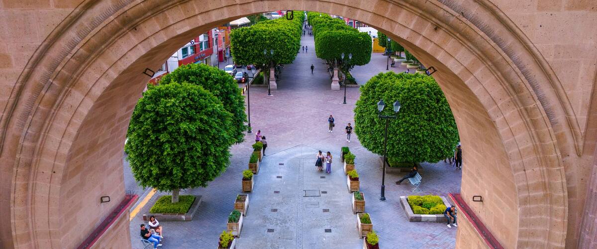 Aerial photo capturing the Calzada de los Heroes in Leon through its Triumphal Arch, a place where locals usually go for a walk.
