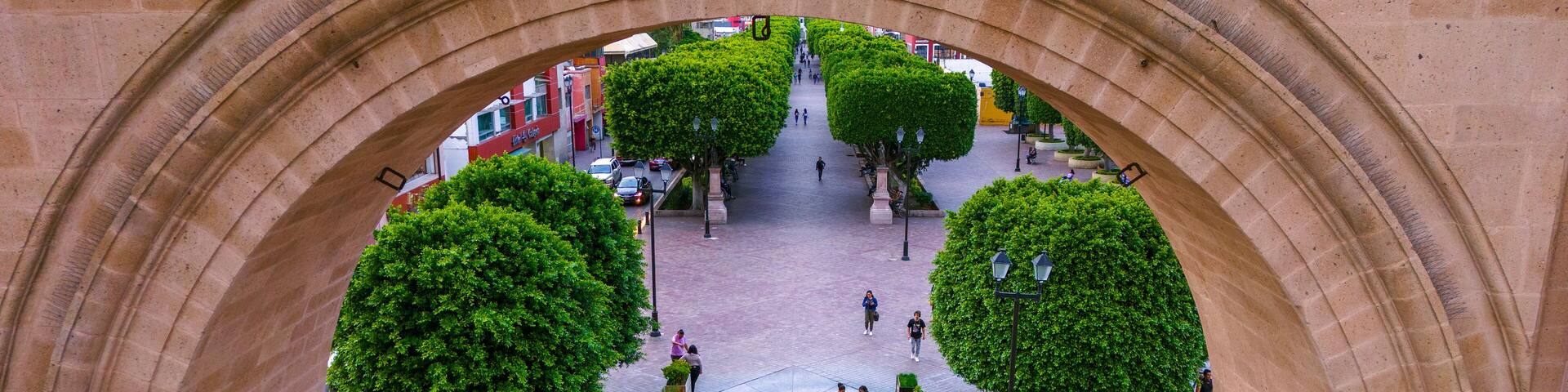 Aerial photo capturing the Calzada de los Heroes in Leon through its Triumphal Arch, a place where locals usually go for a walk.