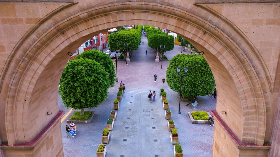 Aerial photo capturing the Calzada de los Heroes in Leon through its Triumphal Arch, a place where locals usually go for a walk.