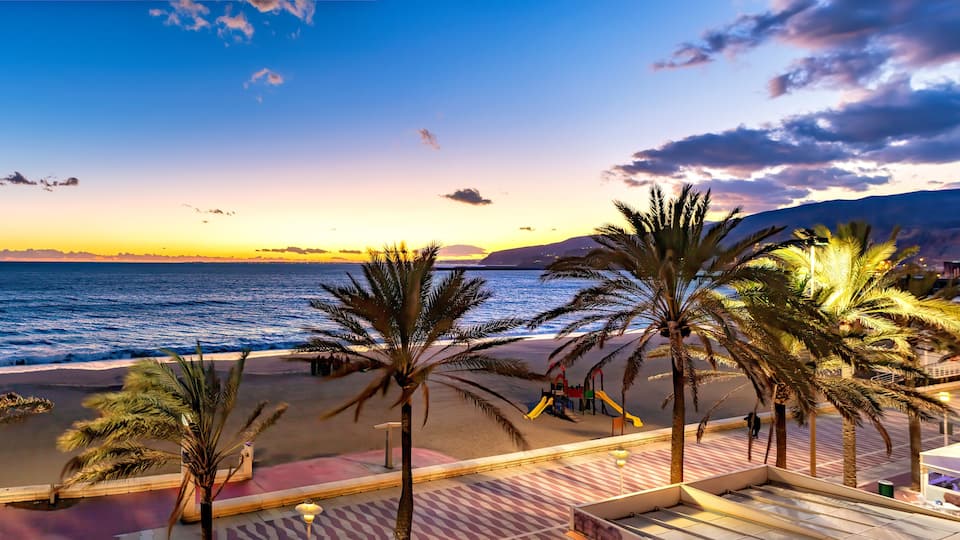 Panoramic view of Mediterranean beach promenade at sunset sunrise in Almeria, Spain.