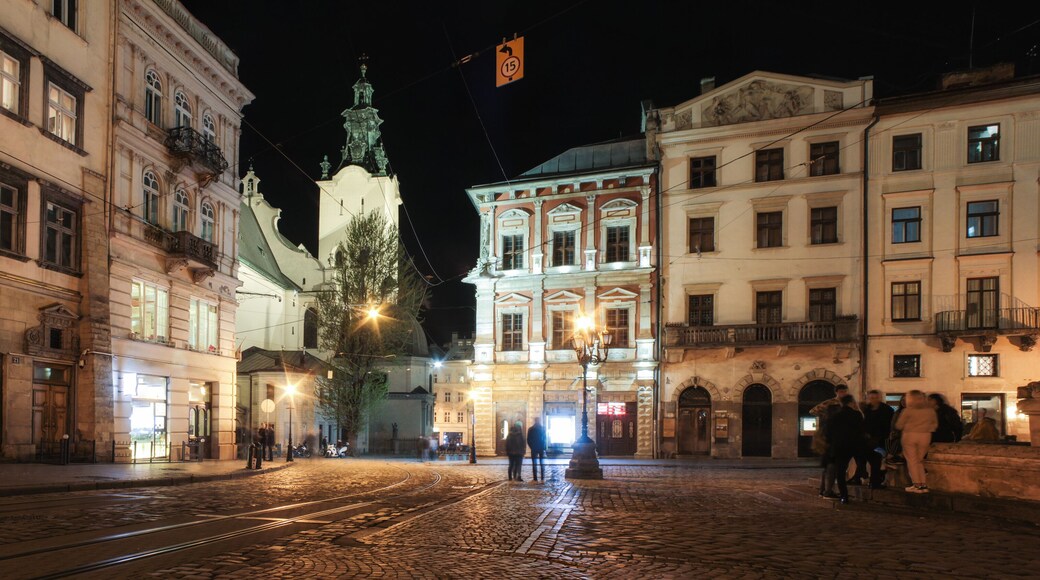 Lviv panorama at night. View of the night street of the European medieval city. Lviv Market square at night. Concept - travel, landmarks, monument of architecture, world heritage. Long exposure