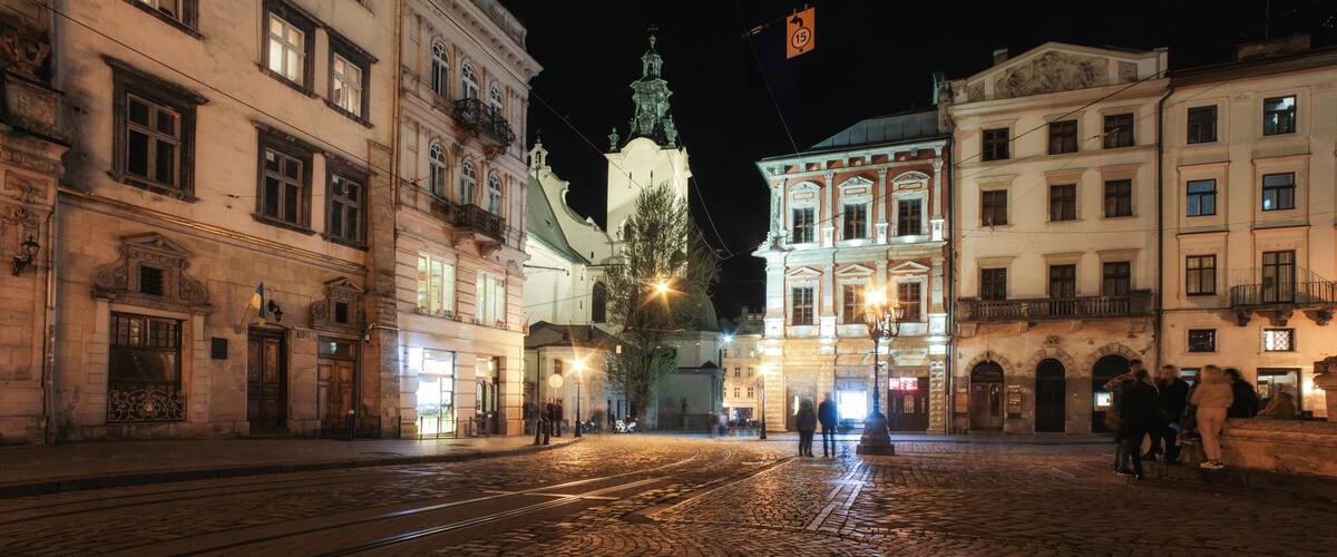 Lviv panorama at night. View of the night street of the European medieval city. Lviv Market square at night. Concept - travel, landmarks, monument of architecture, world heritage. Long exposure
