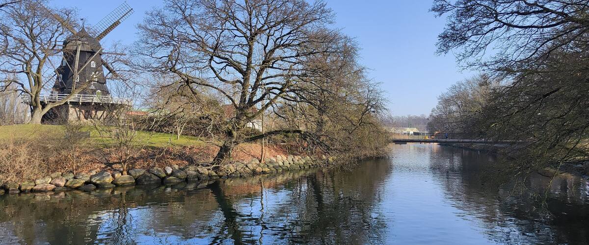 Traditional wooden windmill on hilltop in Castle Park (Slottsparken) - Malmö, Sweden