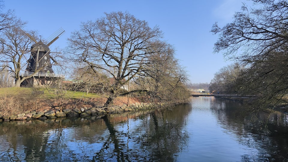 Traditional wooden windmill on hilltop in Castle Park (Slottsparken) - Malmö, Sweden