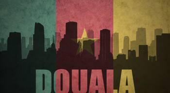 abstract silhouette of the city with text Douala at the vintage cameroon flag
