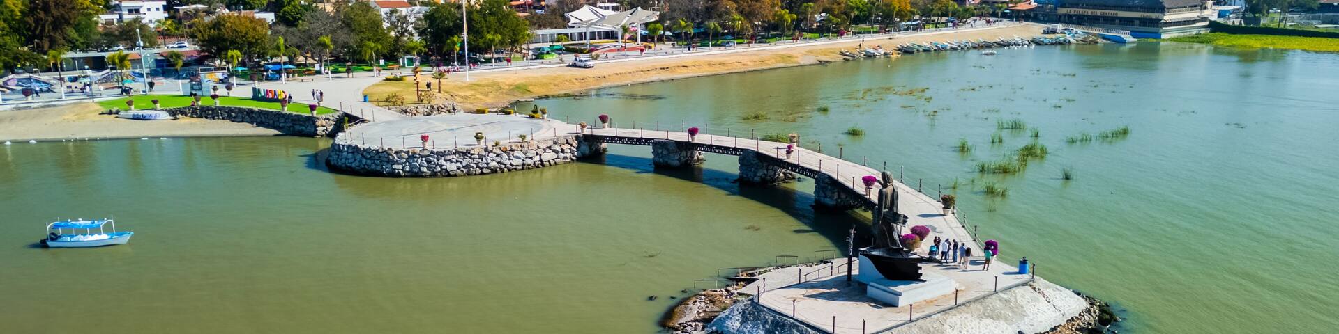 Pier in the town of Chapala leading to the statue of Jesus El Pescador. Jalisco State, Mexico