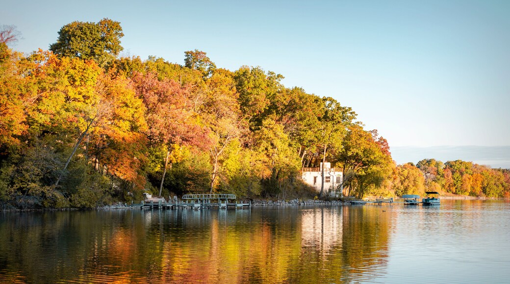The first morning light hits the shoreline of a lake in Waukesha County, Wisconsin on a cold autumn morning.