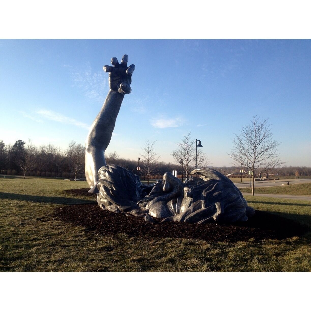 Famous sculpture depicting a giant coming out of the ground. This is actually the second sculpture done by J. Seward Johnson Jr., as the first is located in Washington D.C.