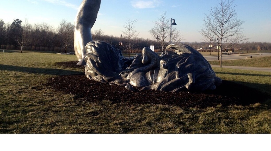 Famous sculpture depicting a giant coming out of the ground. This is actually the second sculpture done by J. Seward Johnson Jr., as the first is located in Washington D.C.